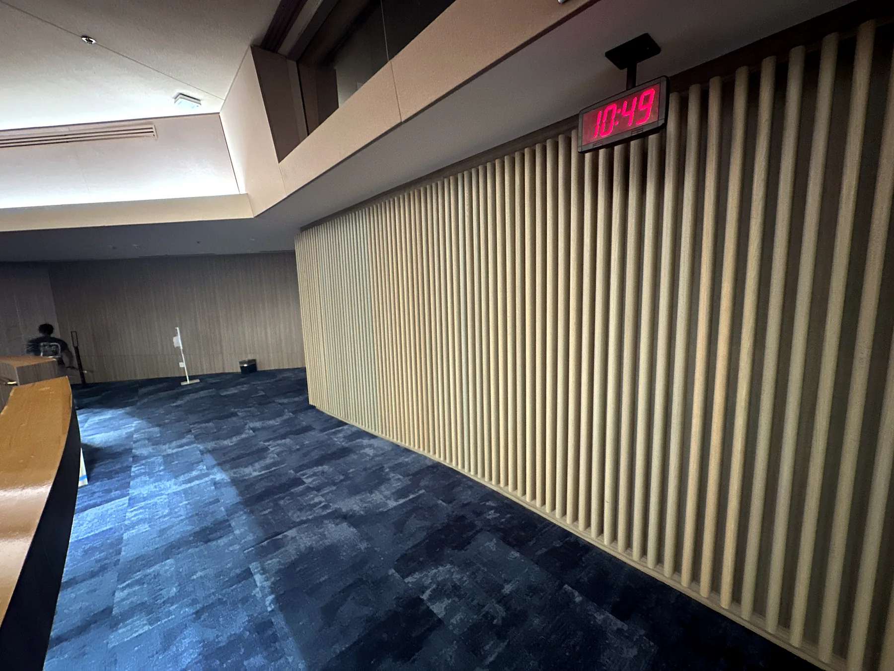 Restained vertical wood slats along the chamber wall