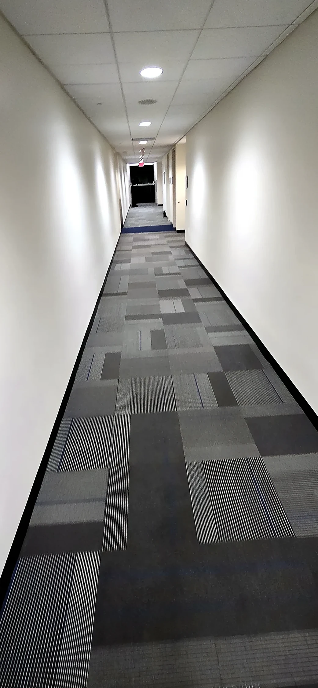 Corridor with new carpet tile after the flood repair