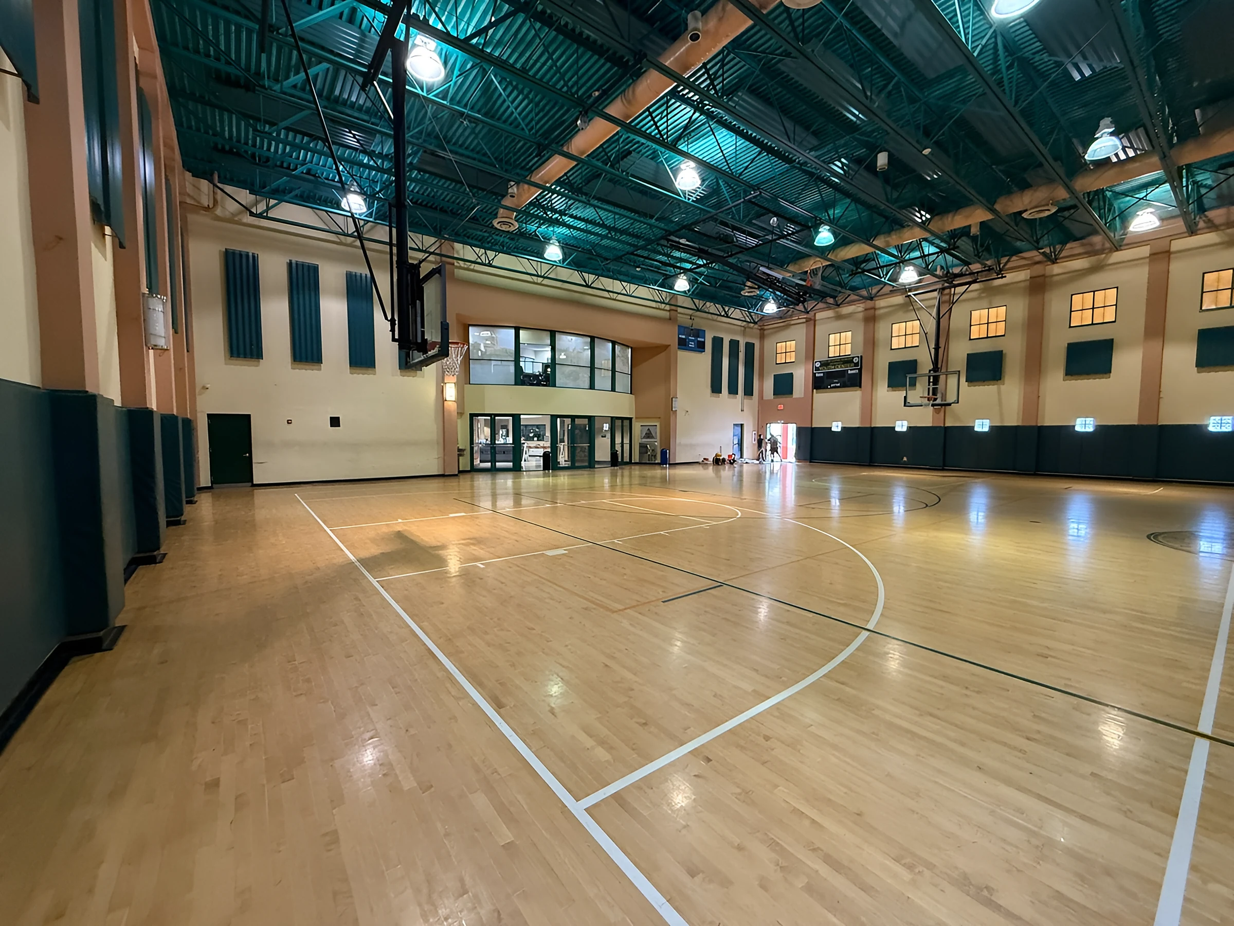 Refinished court and game lines running to the far baseline