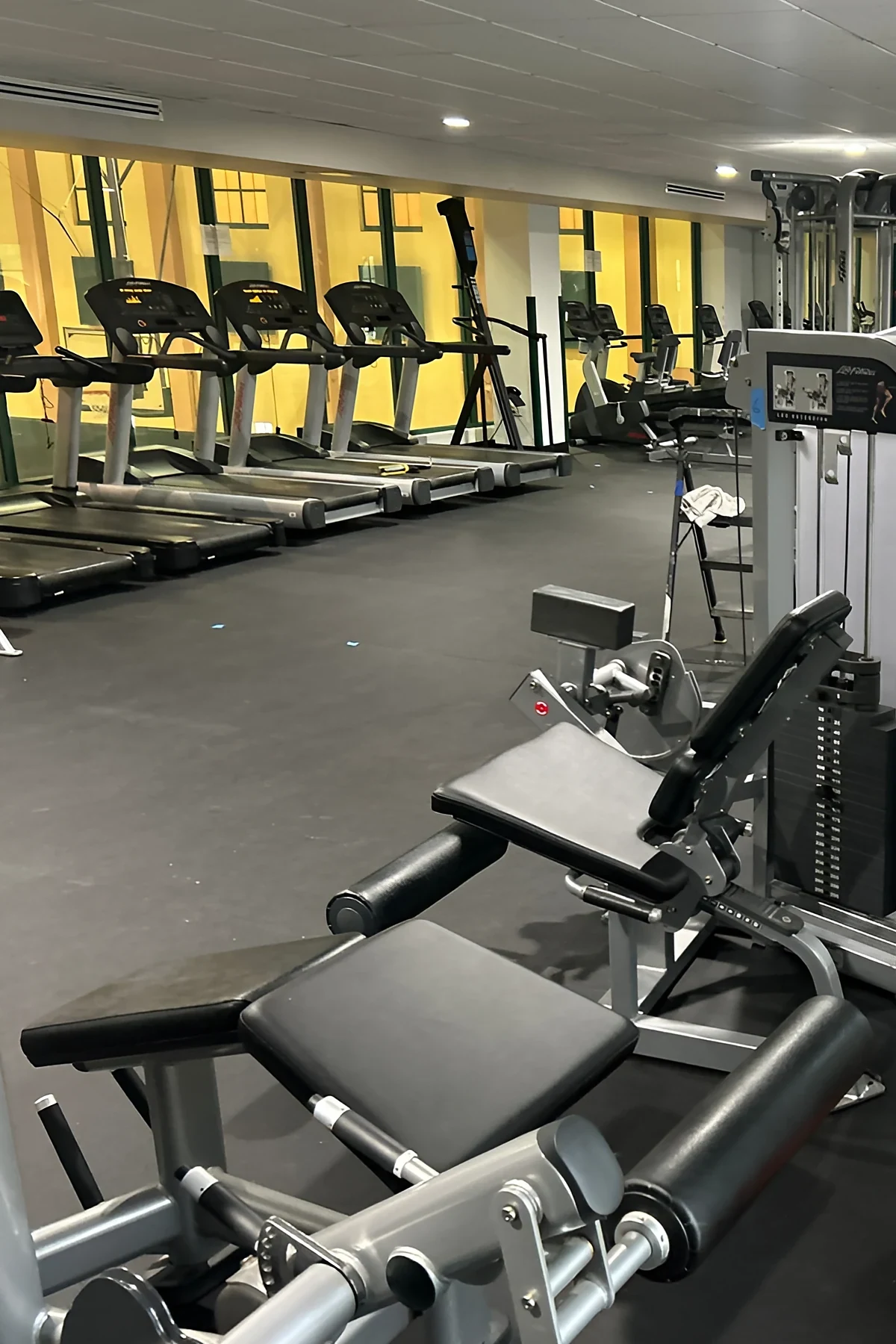 Strength and cardio equipment back in place on the new black rubber floor