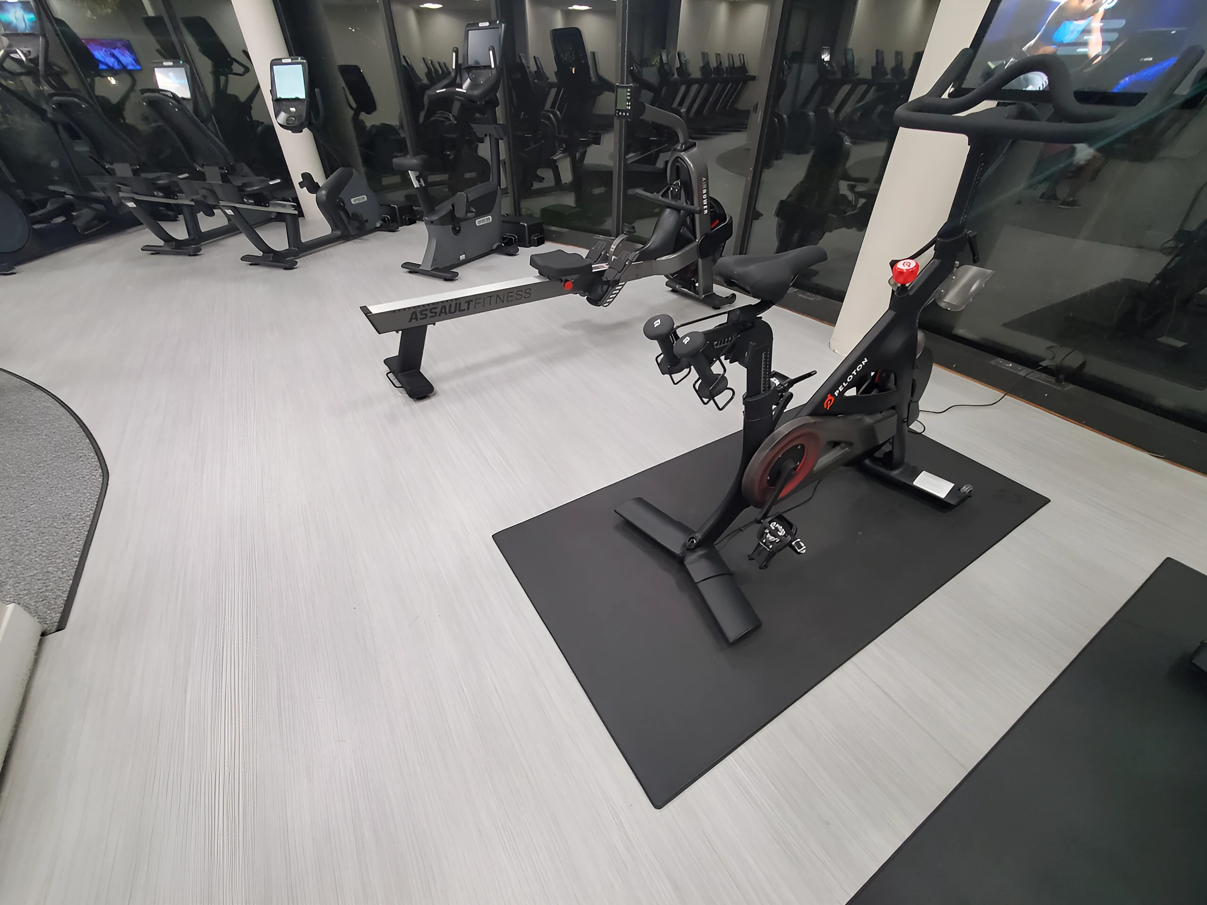 Bikes on mats over the light plank floor