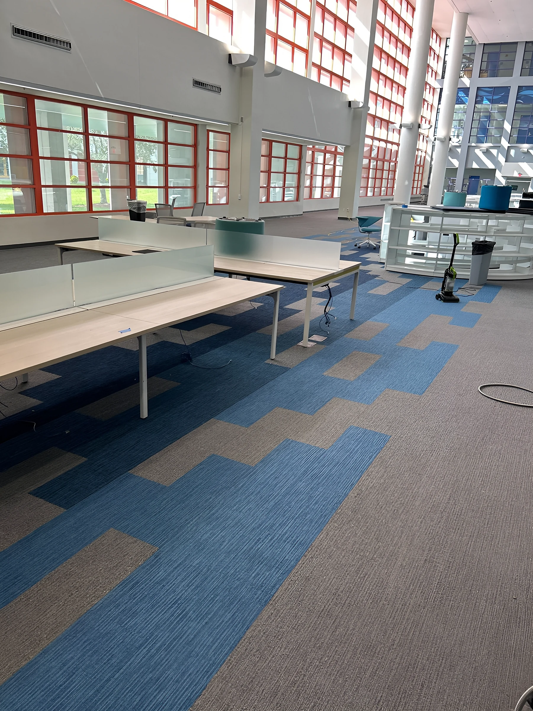 Study tables in the library, set on the new carpet