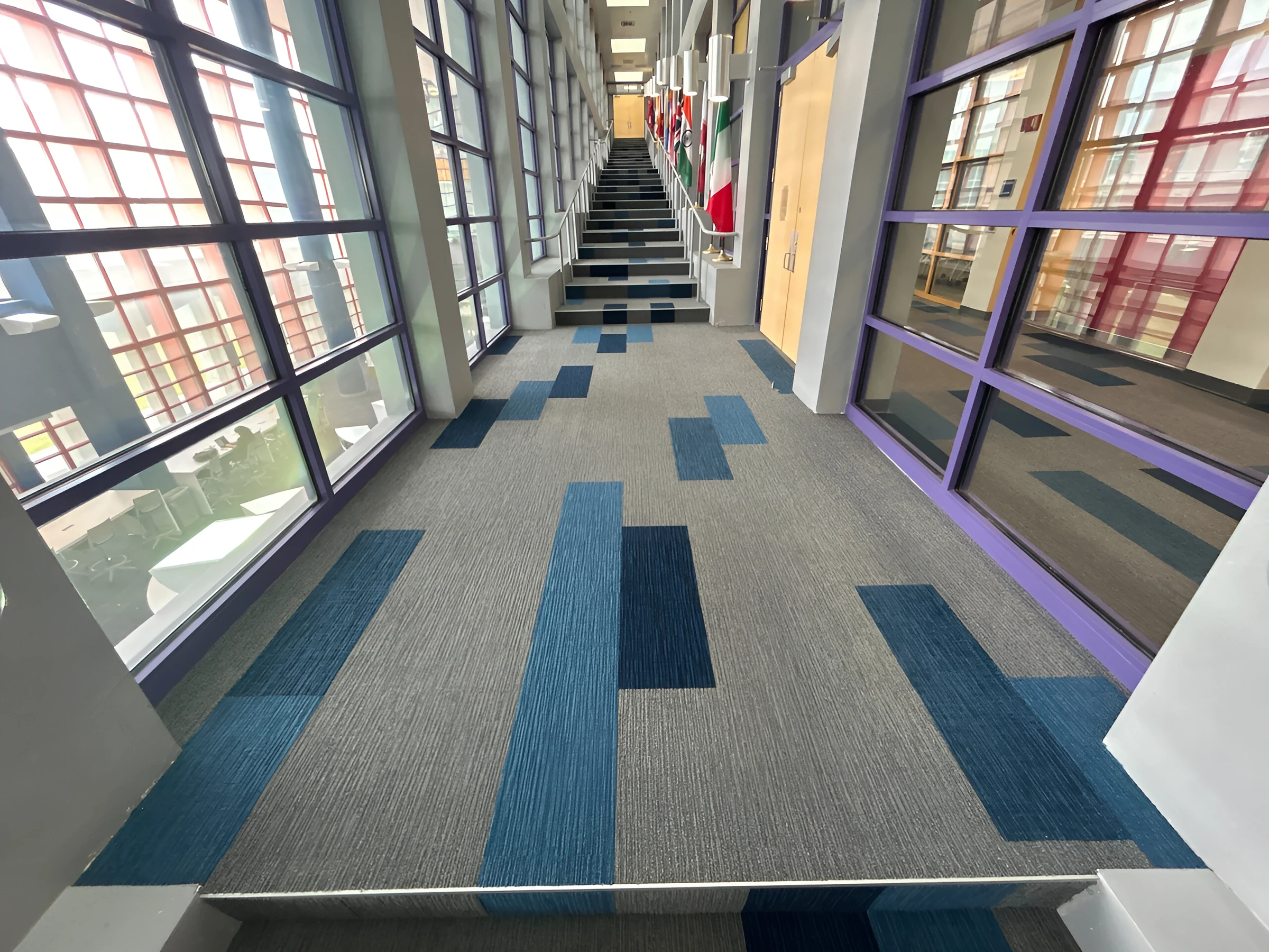 Blue carpet blocks climbing the grand stairwell at MDC Homestead