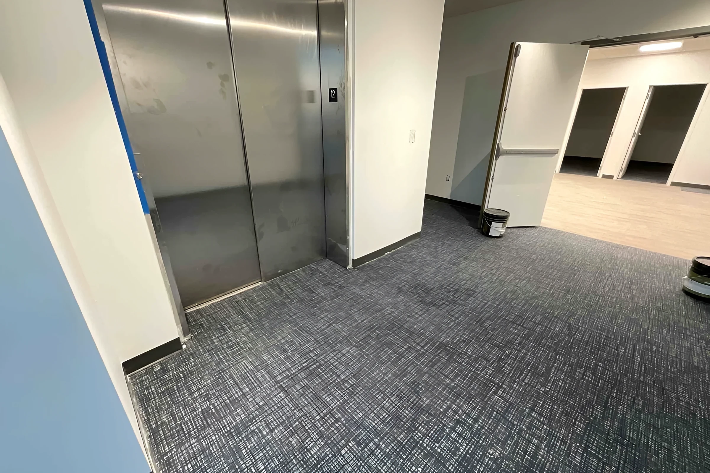 Elevator lobby with new carpet tile