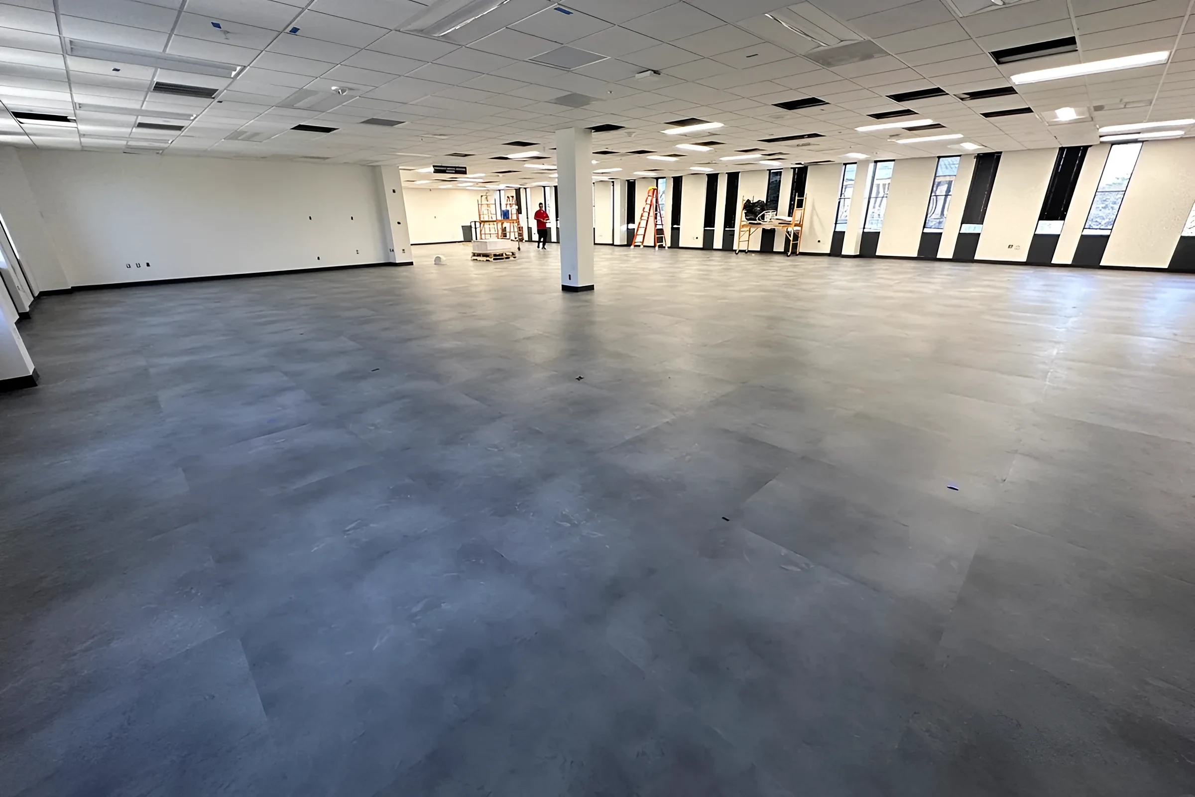 Open floor with new flooring and a window wall