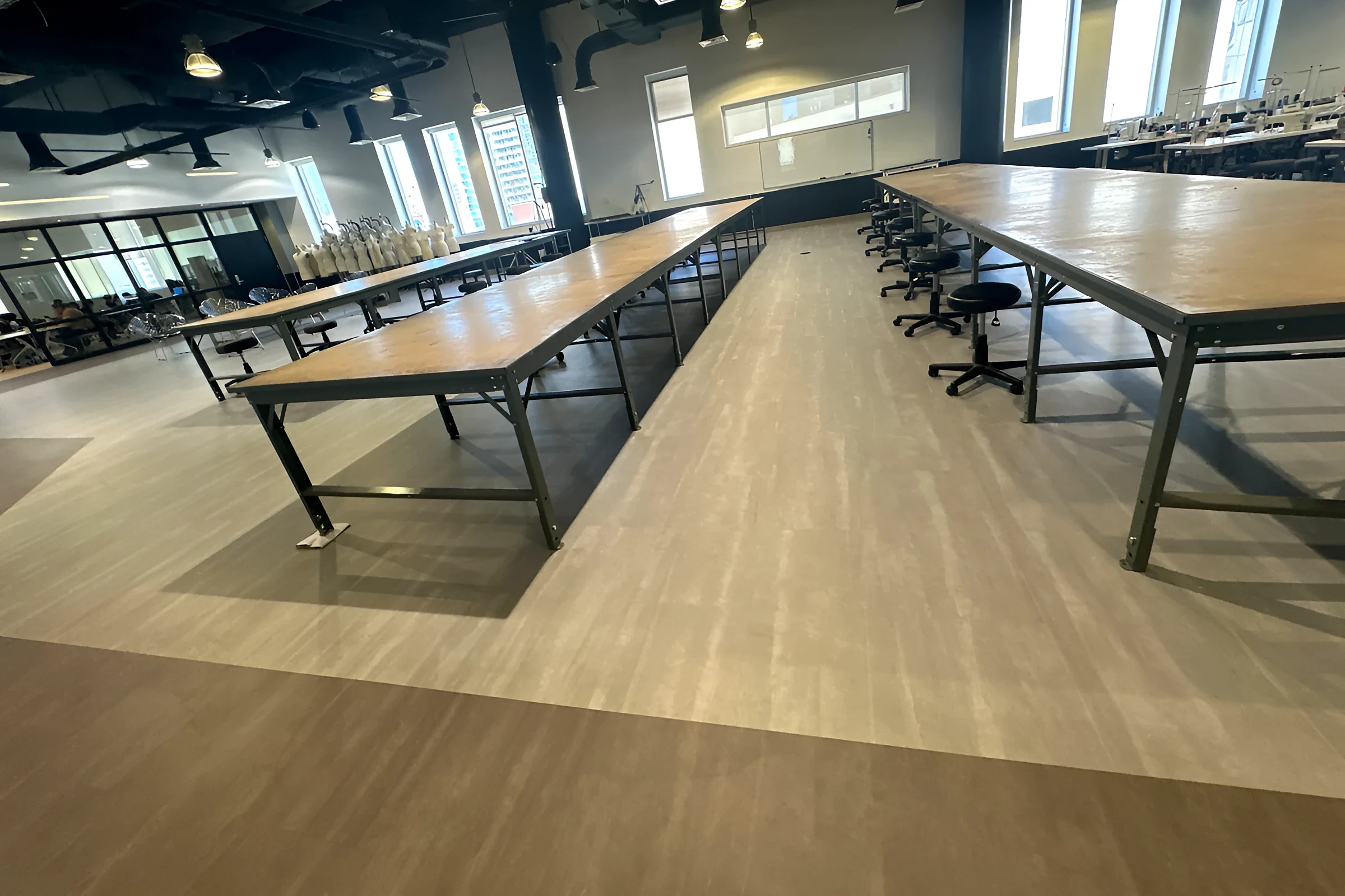 Cutting tables on light and dark LVT bands