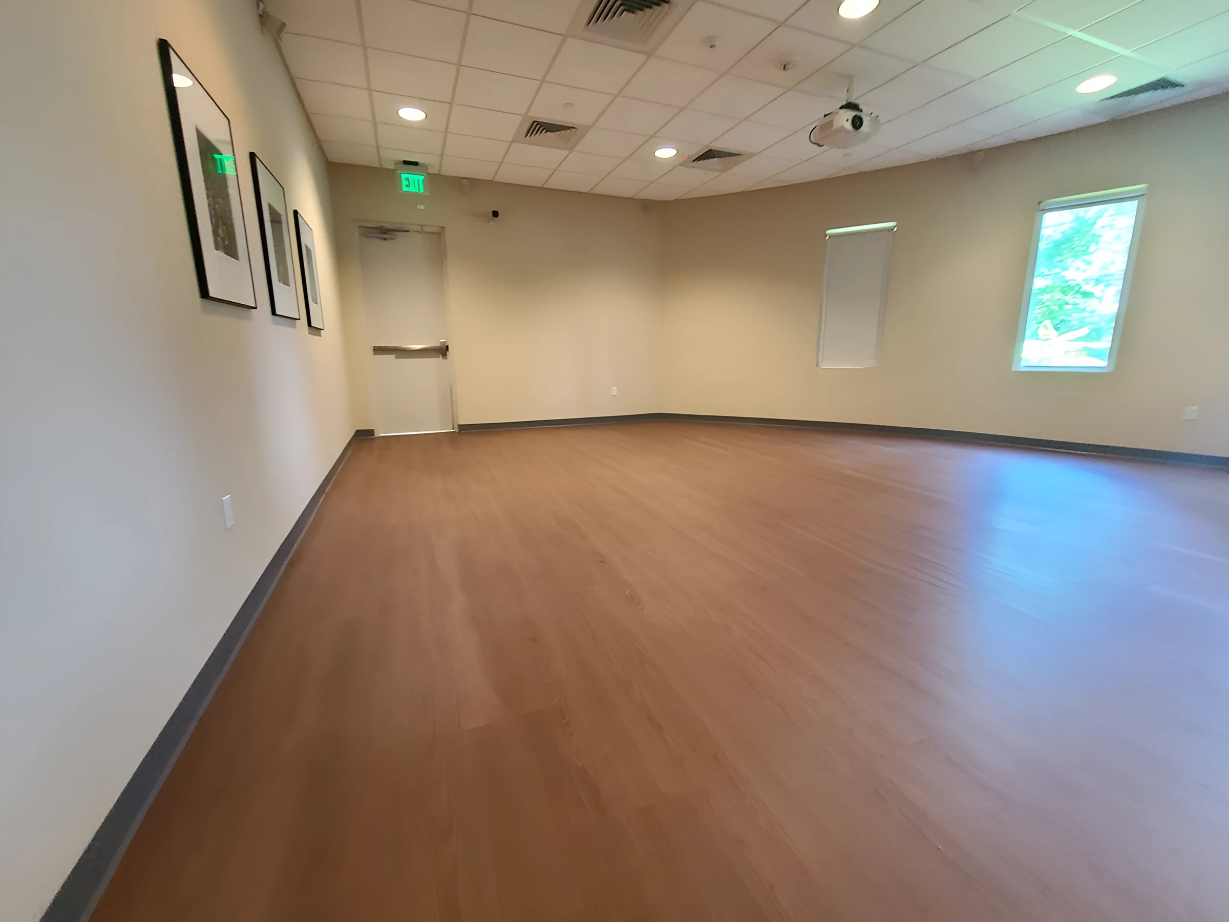 A meeting room finished in warm wood-look plank
