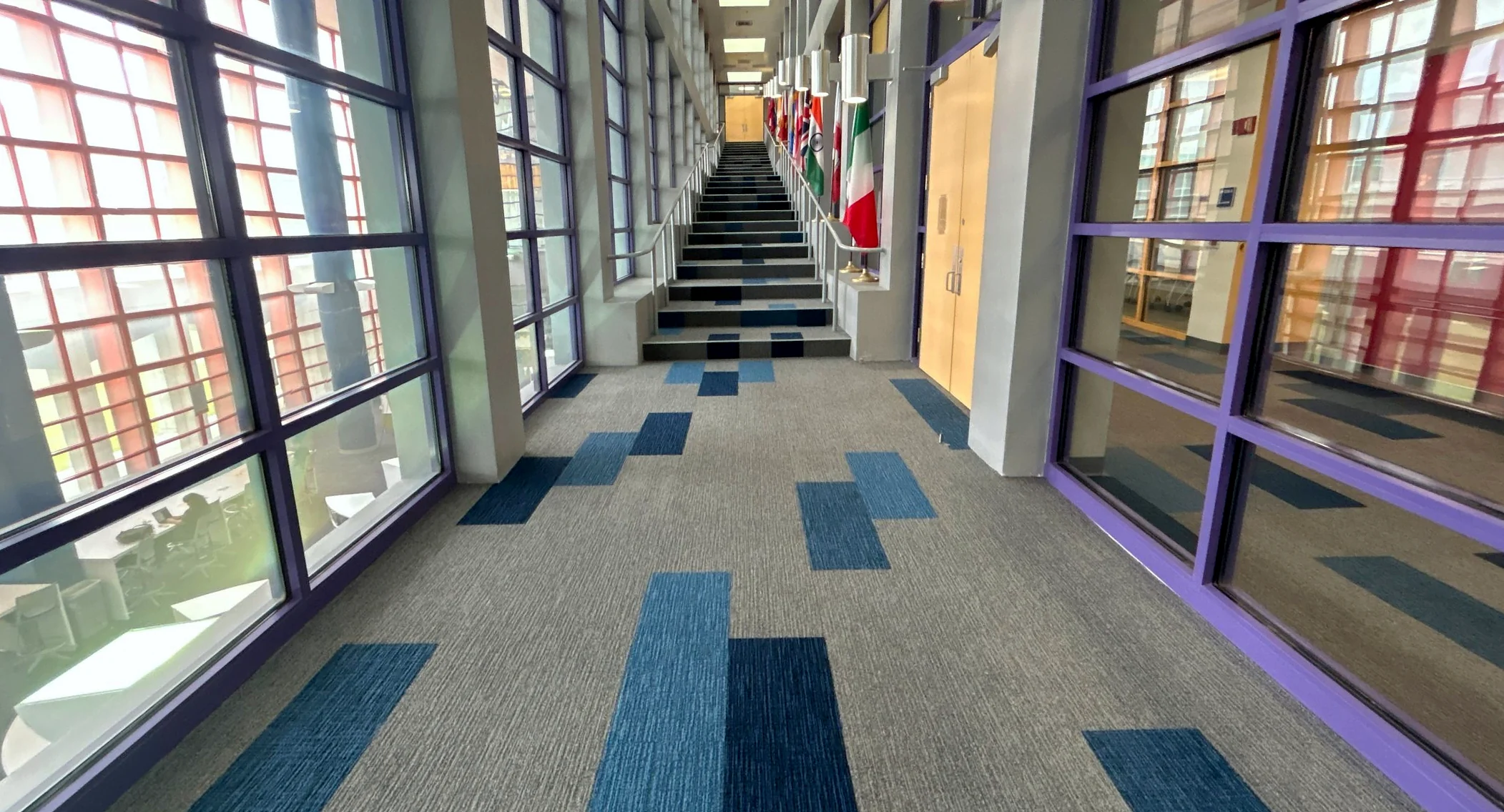 Blue carpet planks running up the grand stairwell at Miami Dade College Homestead