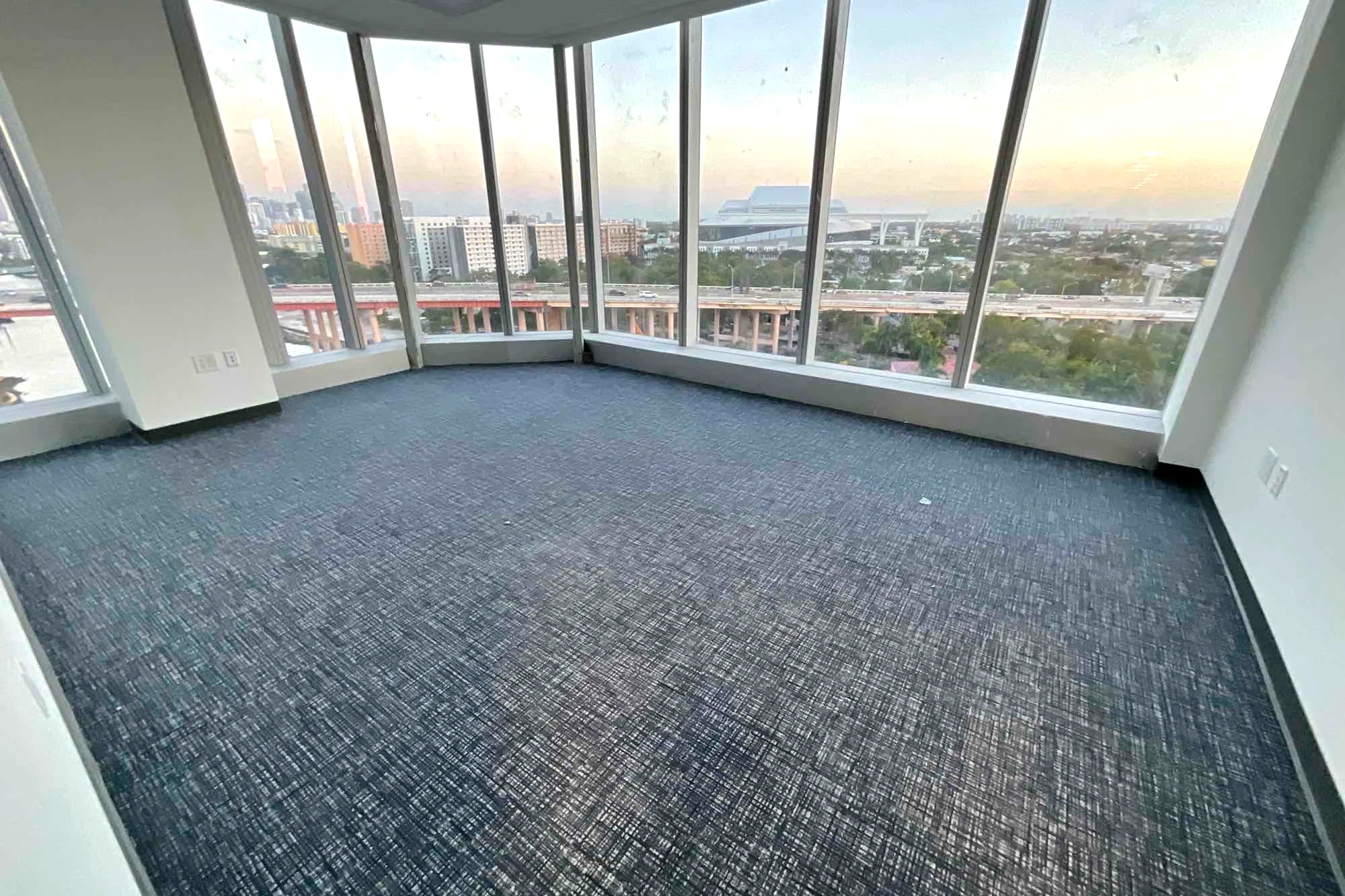 Corner office with new carpet tile over the Miami River